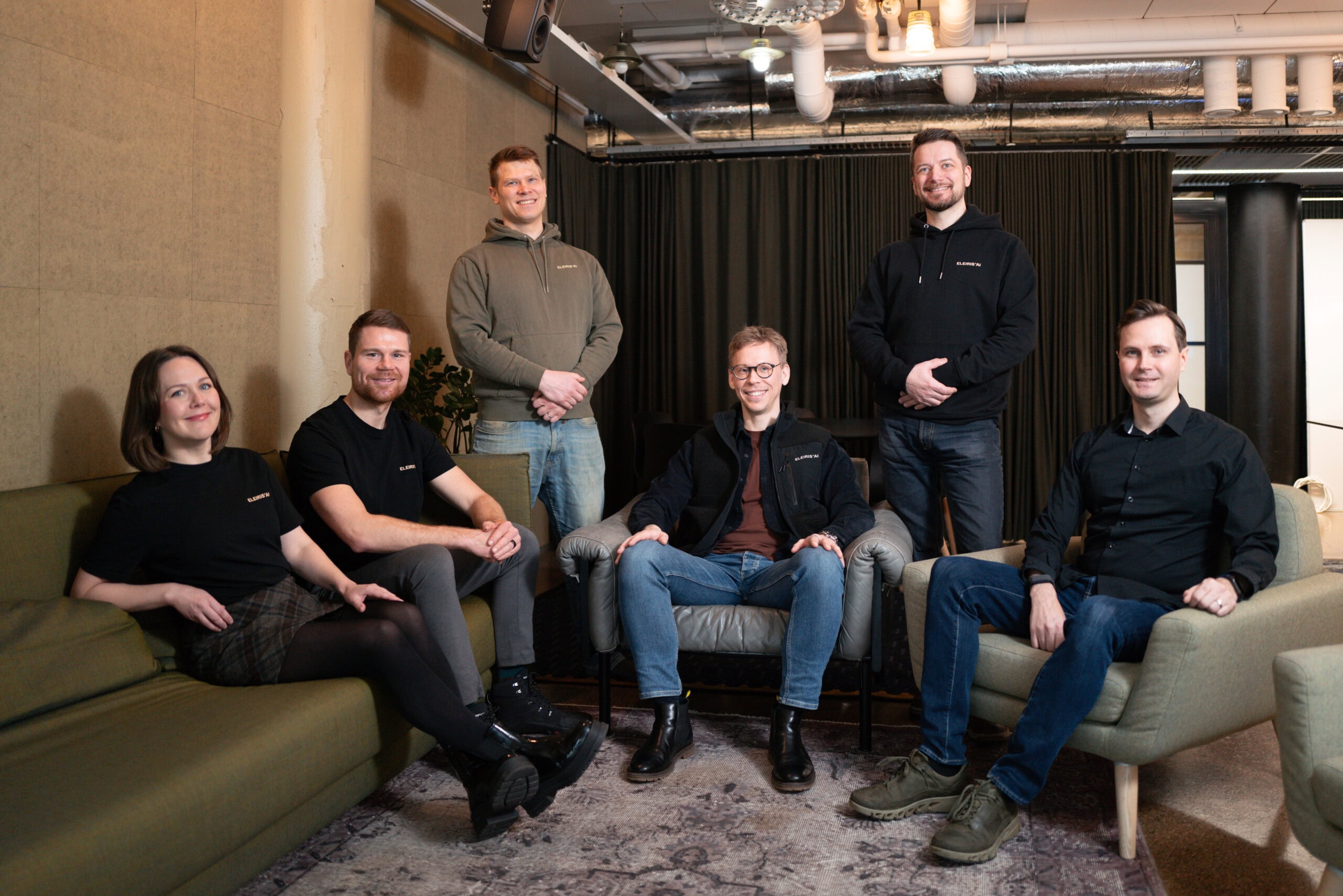 Eleiris team smiling to the camera.